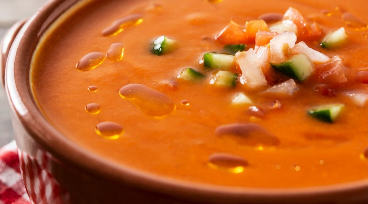 Classic Spanish gazpacho with ripe tomatoes, cucumbers, bell peppers, and onions