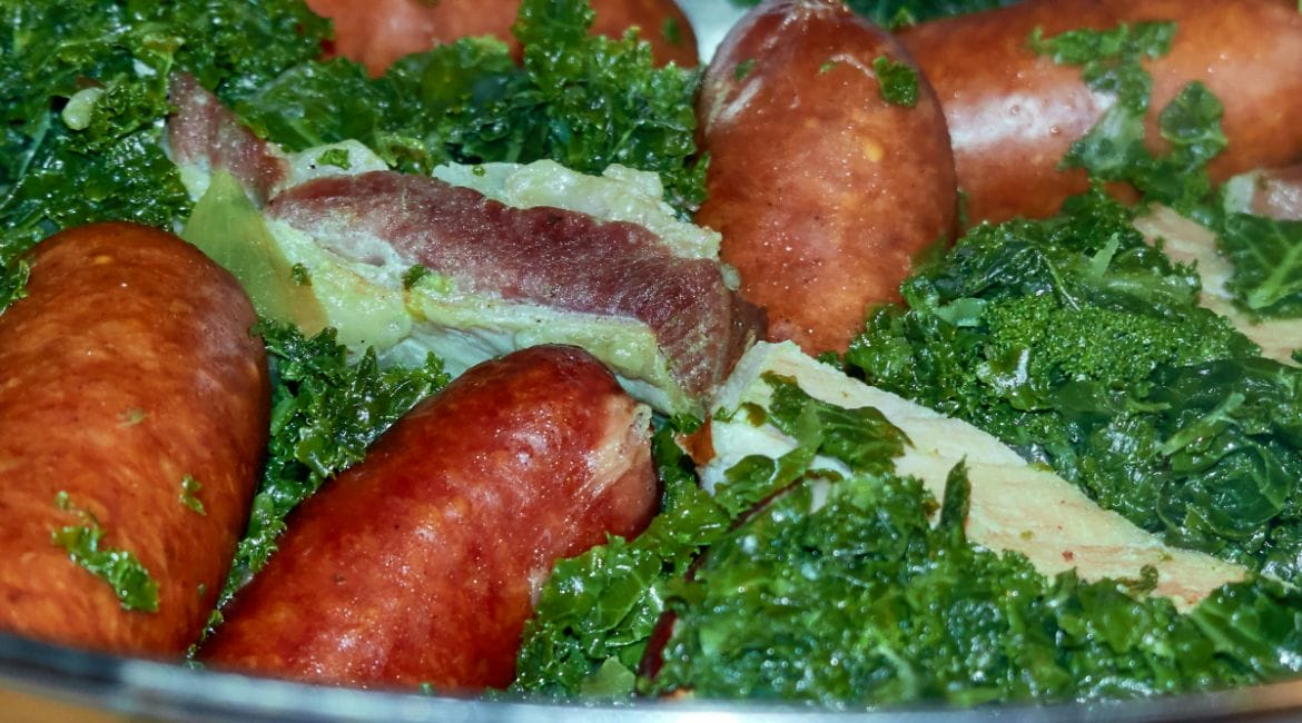 Traditional German Grünkohl with Bregenwurst sausage