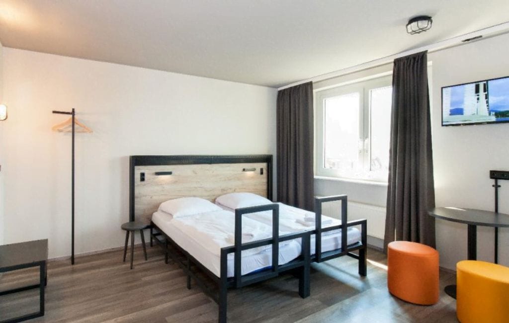 Cozy room at A&O Berlin Mitte with modern amenities.