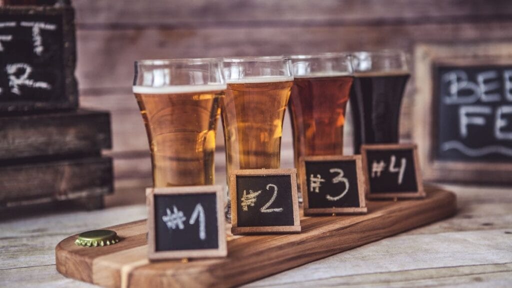 Variety of rated Belgian beers on a tasting tray, part of Top 5 Culinary Experiences in Europe