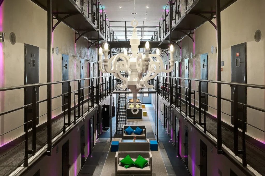 Impressive Lobby of Het Arresthuis featuring original prison architecture with modern luxurious decor