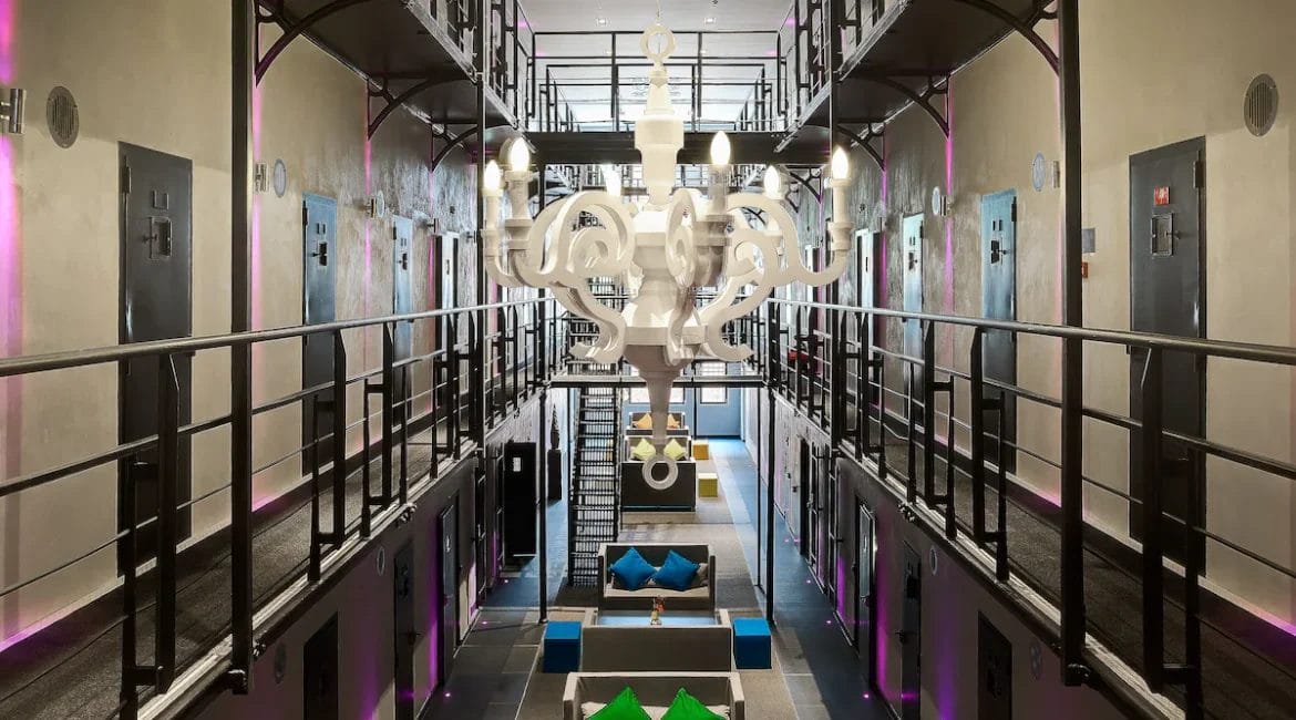 Impressive Lobby of Het Arresthuis featuring original prison architecture with modern luxurious decor