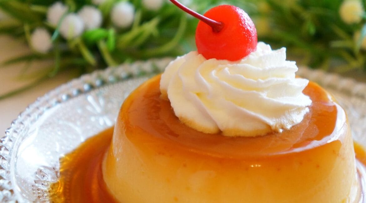 Homemade flan with caramel topping on a white plate