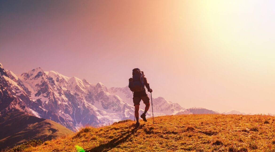 Hiker enjoying sunset on an Alpine summit