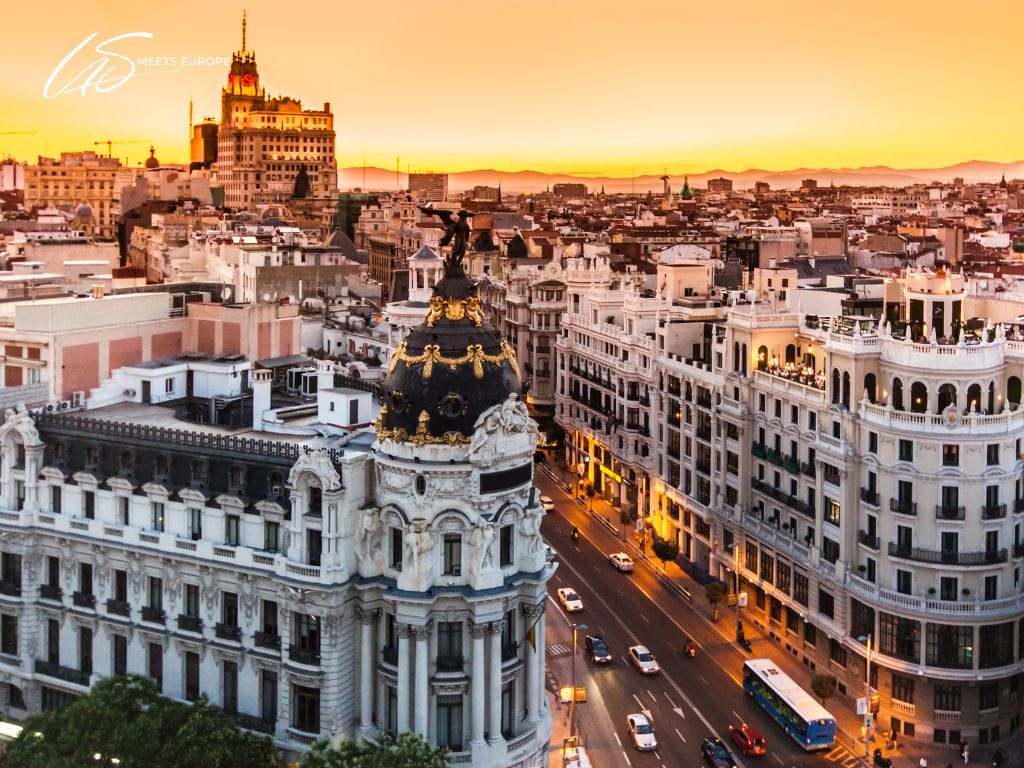 Panoramic view of Madrid with iconic skyline and historic buildings.