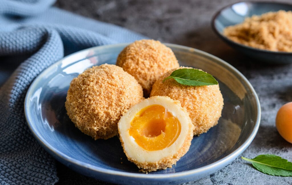 Traditional Austrian apricot dumplings with powdered sugar