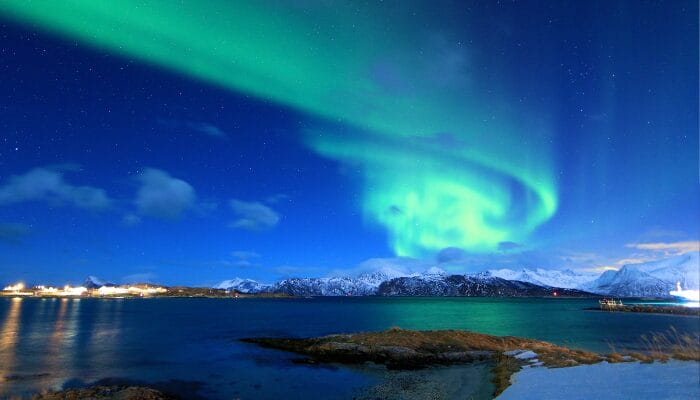 The typical Northern Lights in the night sky over Norway.