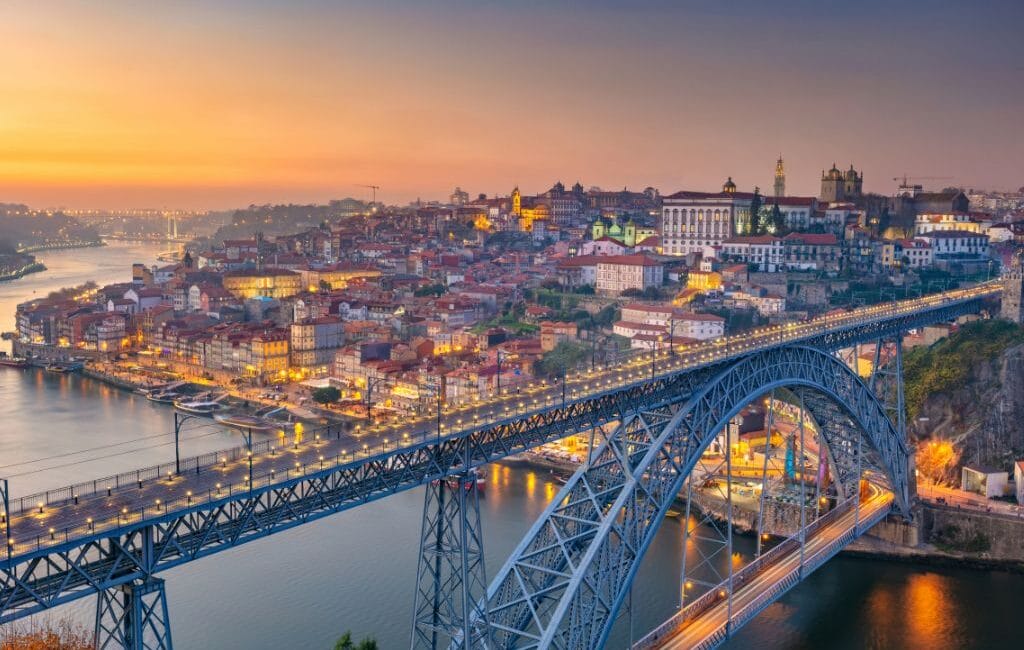 Evening view of Porto along the Douro River during a river cruise.