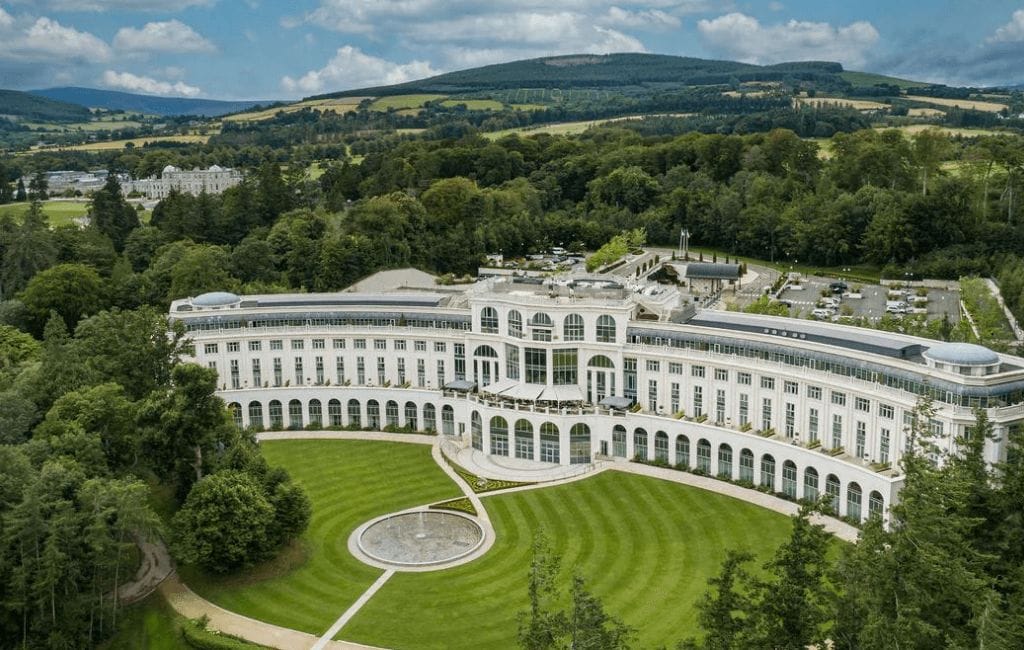 Exterior view of the elegant Powerscourt Hotel in Wicklow, showcasing its luxurious architecture and picturesque surroundings.