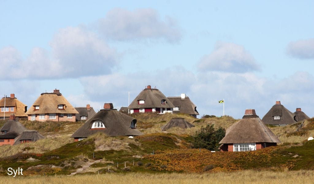 Thatched-roof houses in the dune landscape of Sylt