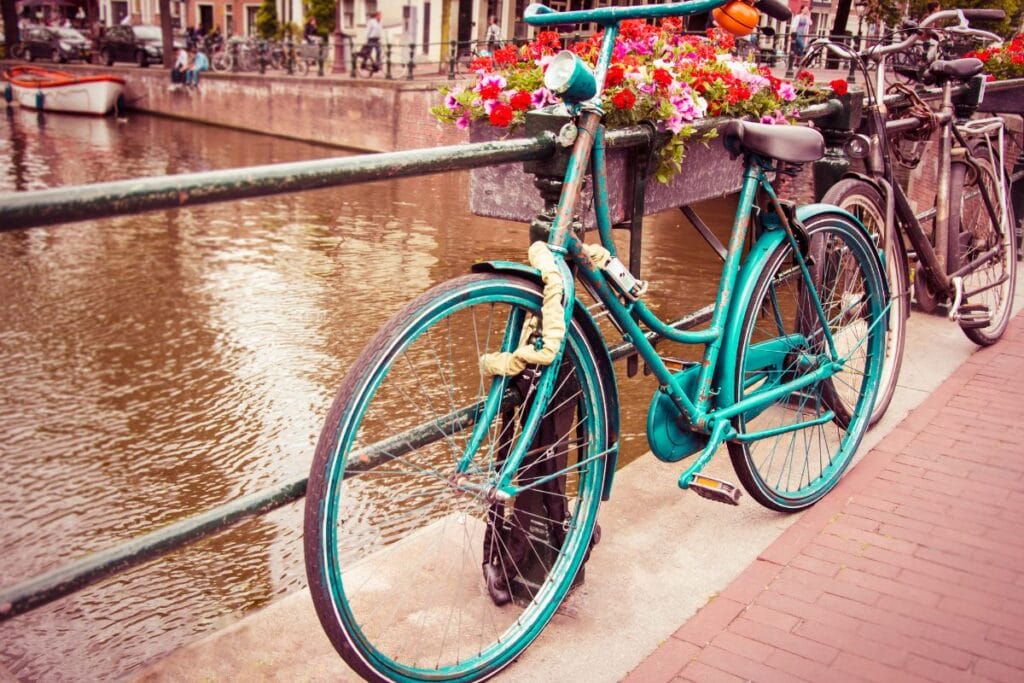 Old bicycle by a canal in the Netherlands