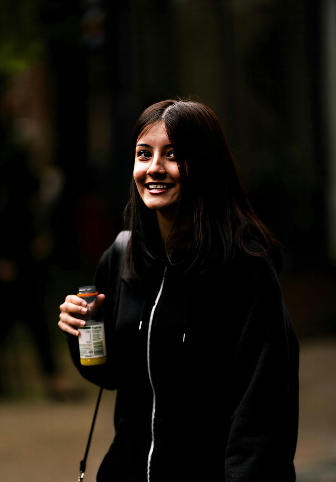 Young Spanish woman dressed in black clothing, illustrating cultural differences in dress codes between Spaniards and Americans